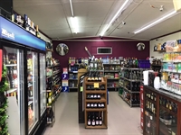 absentee-operated liquor store with - 1