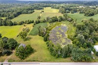 scenic farmland with pond - 1